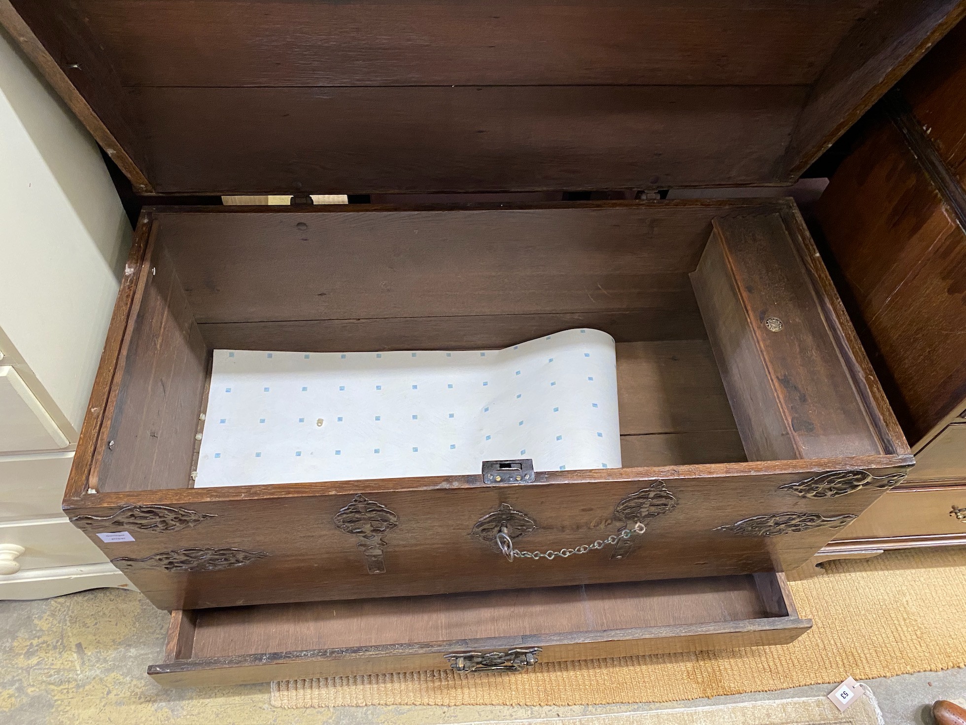 A 17th century style iron bound dome top oak trunk, width 117cm, depth 56cm, height 74cm